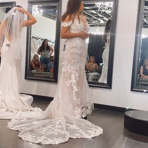 Lace fit and flare wedding dress